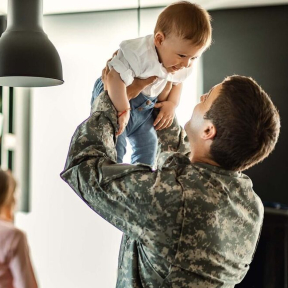 Soldier thinking about 529 Roth IRA rollover for baby